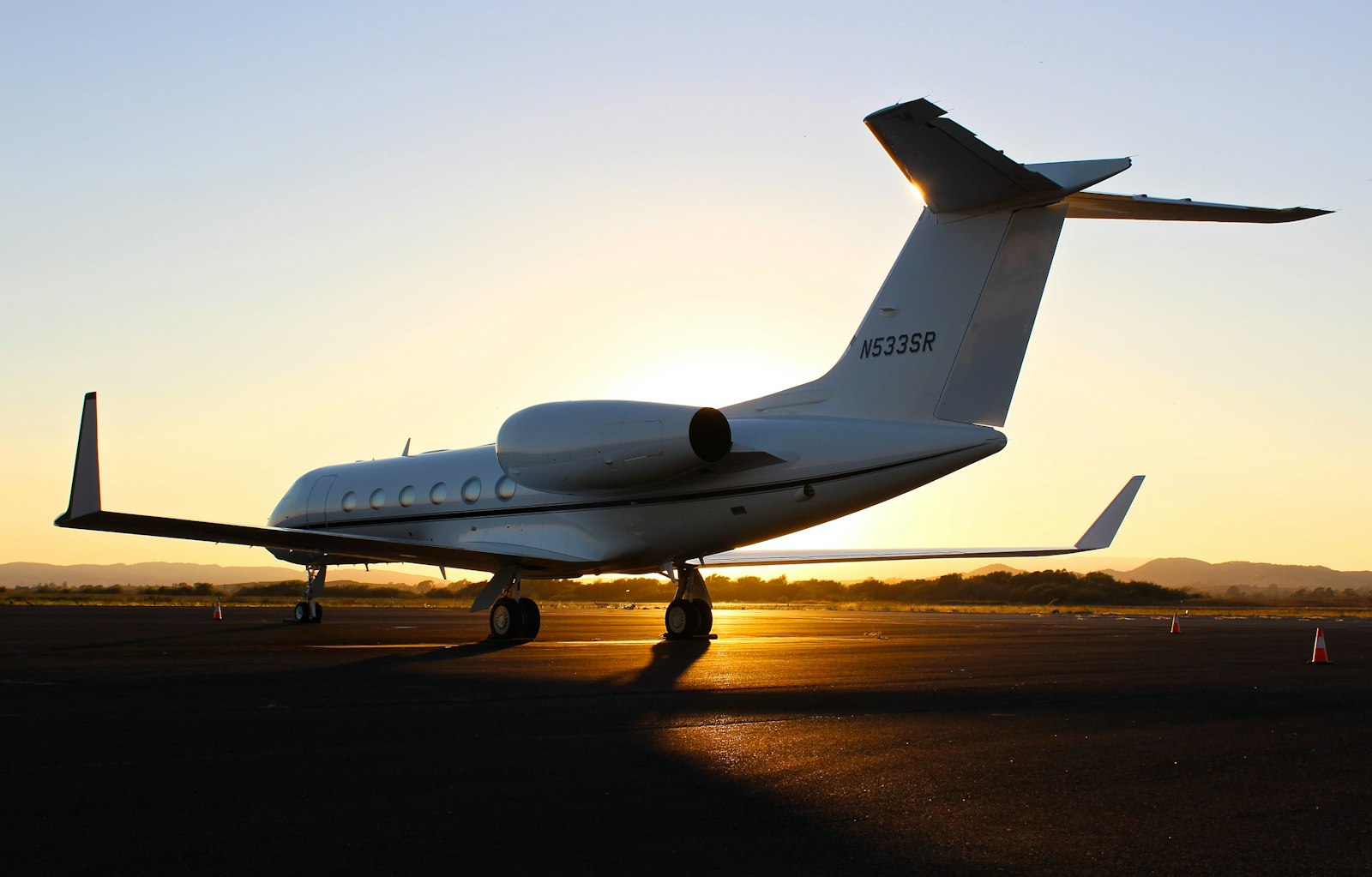 Business jet on the apron at sunset